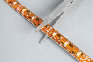 FLUXIA Low Profile 5m LED Tape in green color, showcasing its self-adhesive and super bright lighting features, designed for water resistance.