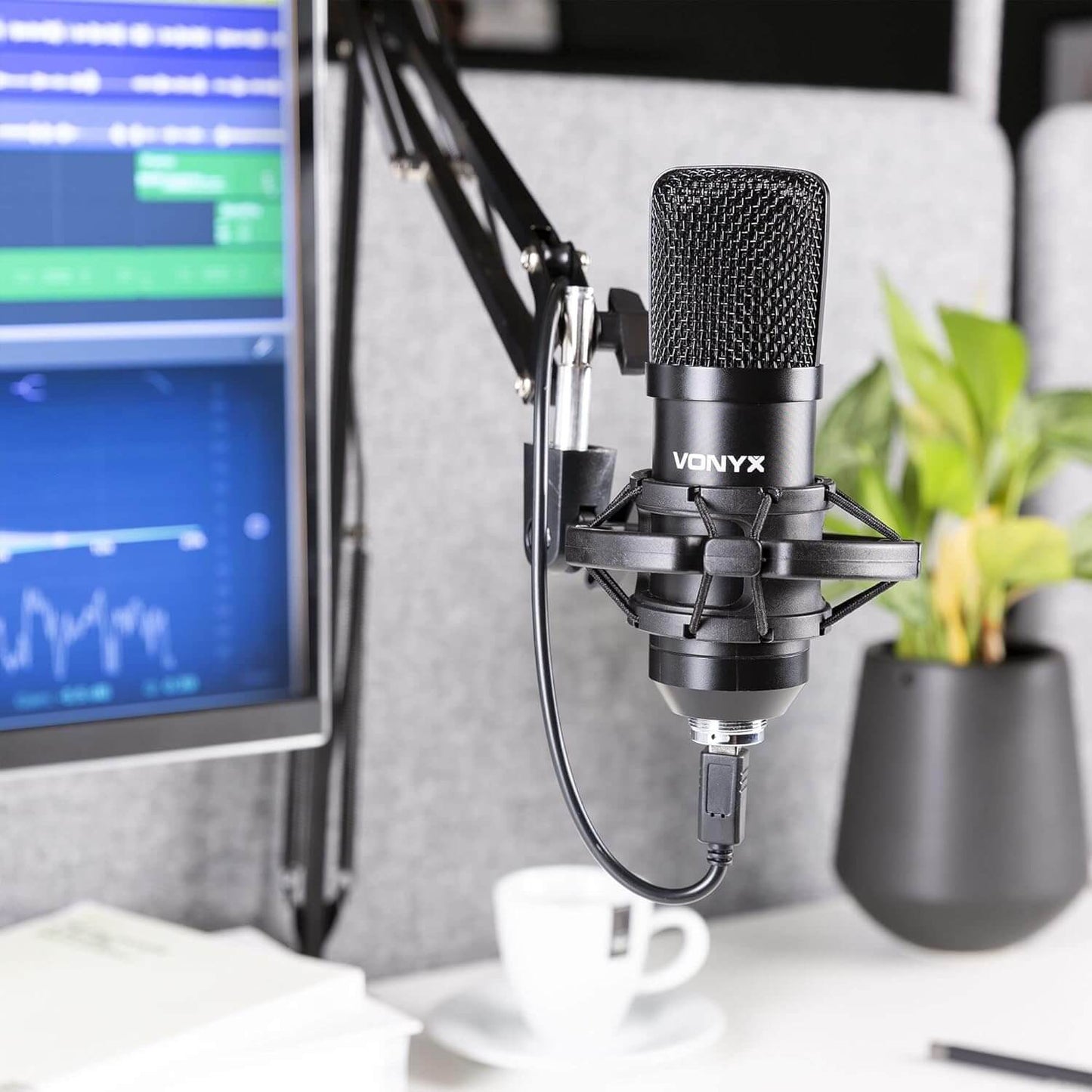 VONYX CMS300B Studio Set featuring a black USB condenser microphone with an adjustable stand and pop filter.