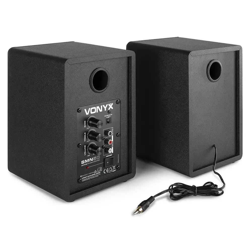 VONYX SMN50B Active Studio Monitor Speakers in black with isolation pads, showcasing a pair of 5-inch speakers designed for high-quality sound production.