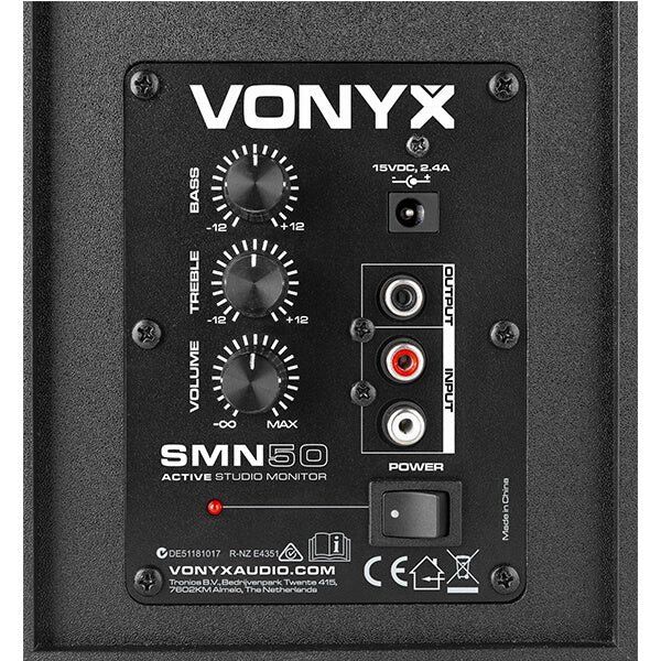 VONYX SMN50W Active Studio Monitor Speakers in white color, featuring a 5-inch design, displayed in a studio setting.