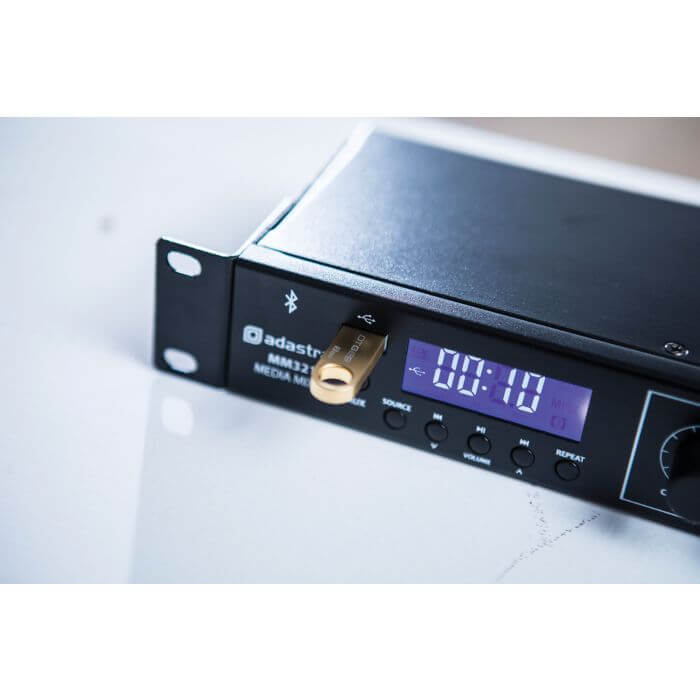 ADASTRA MM321 Rack Mixer with Bluetooth, USB, and FM Player displayed on a rackmount setup.