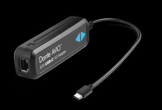 Image of the Audinate Dante AVIO USBC IO Adapter 2x2 featuring show connectors and a long cable.