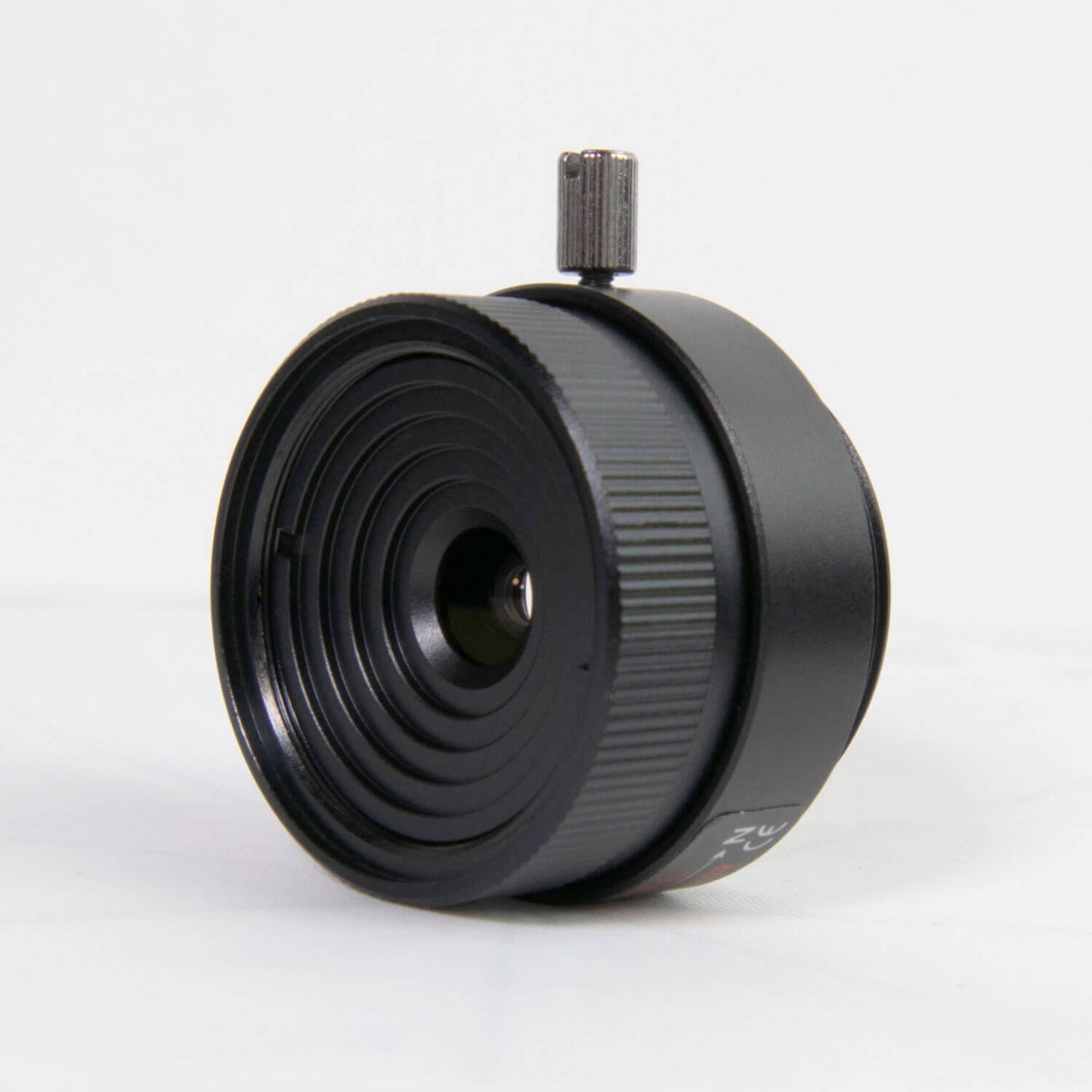 AIDA Imaging 12mm HD CS Mount Lens designed for 1.3 to 5MP cameras, showcasing its fixed focal design.
