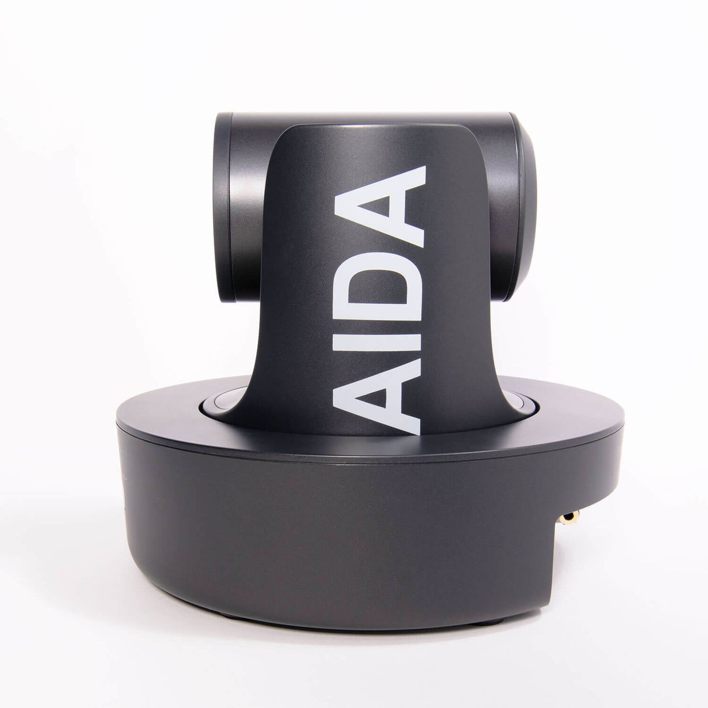 AIDA Imaging PTZ-NDI-X12 Broadcast/Conference Camera featuring 12X optical zoom, with connections for NDI|HX, HDMI, SDI, and USB3 in Full HD.