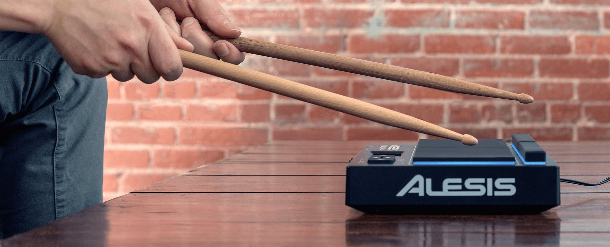 Alesis Sample Pad 4, a 4-pad percussion and sample-triggering instrument with a built-in library.