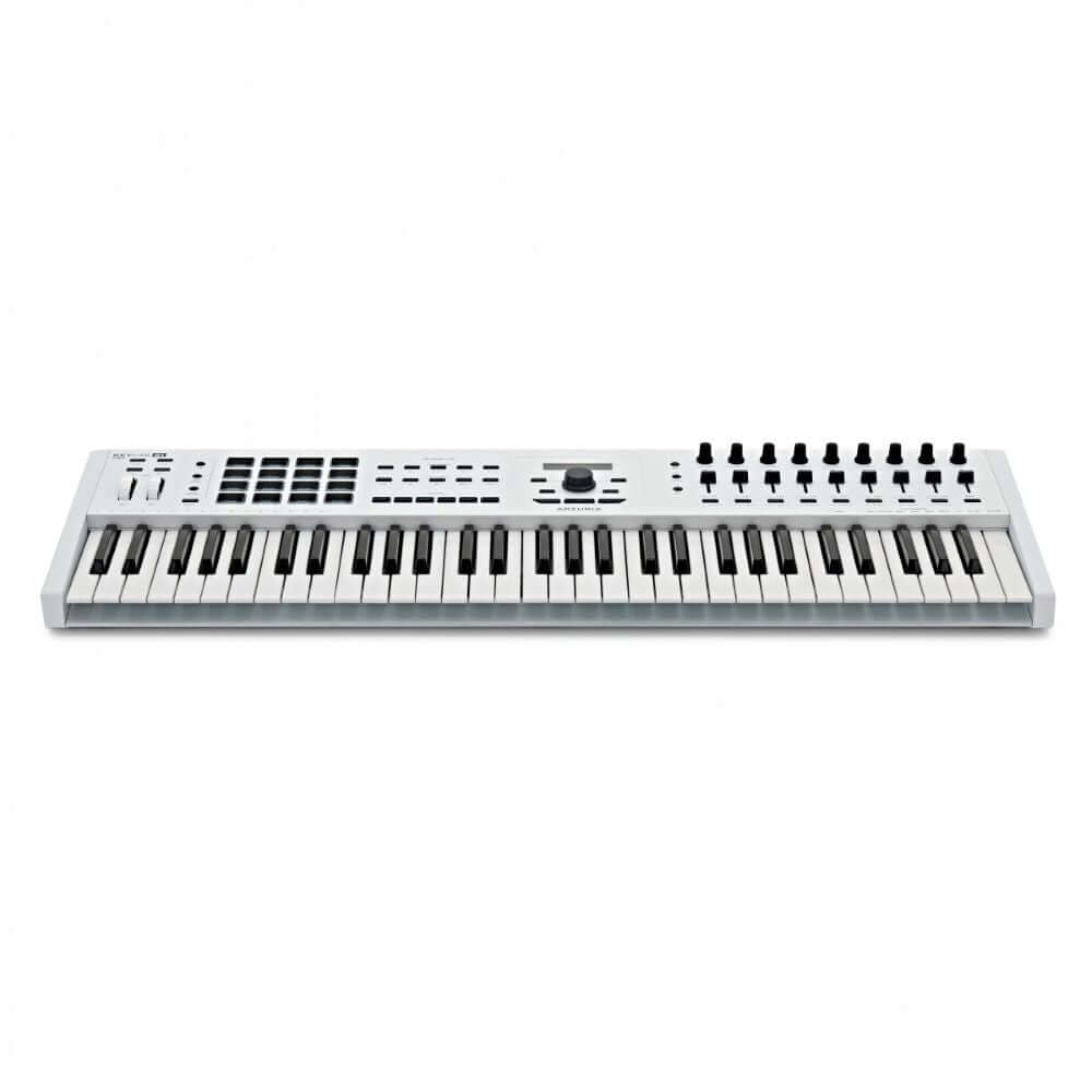 Arturia KeyLab 61 MKII White USB MIDI Controller, a professional keyboard with a software package, displayed in a studio setting.