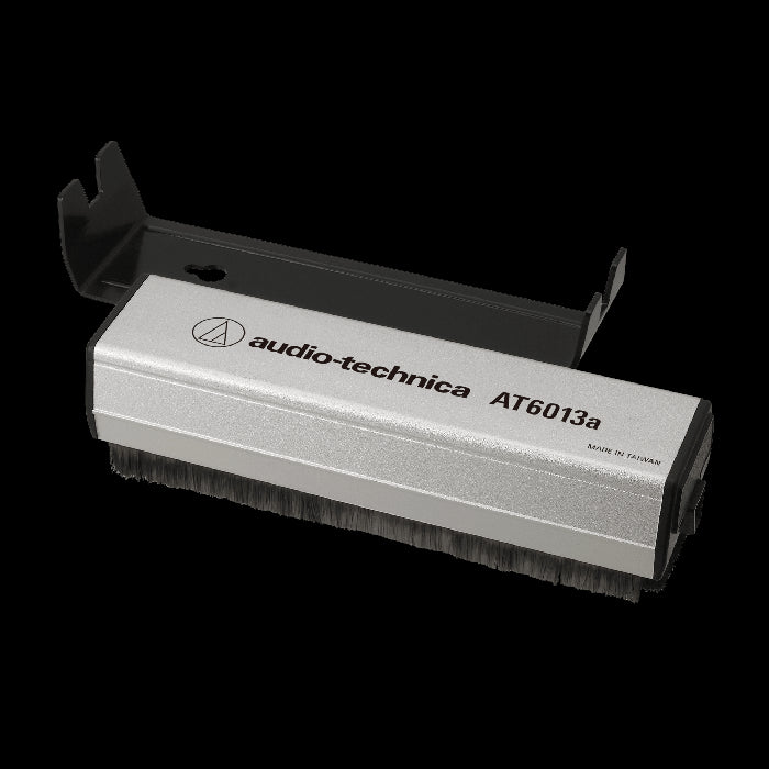Audio-Technica AT6013A Dual-Action Anti-Static Record Brush with a sleek design, used for cleaning vinyl records.