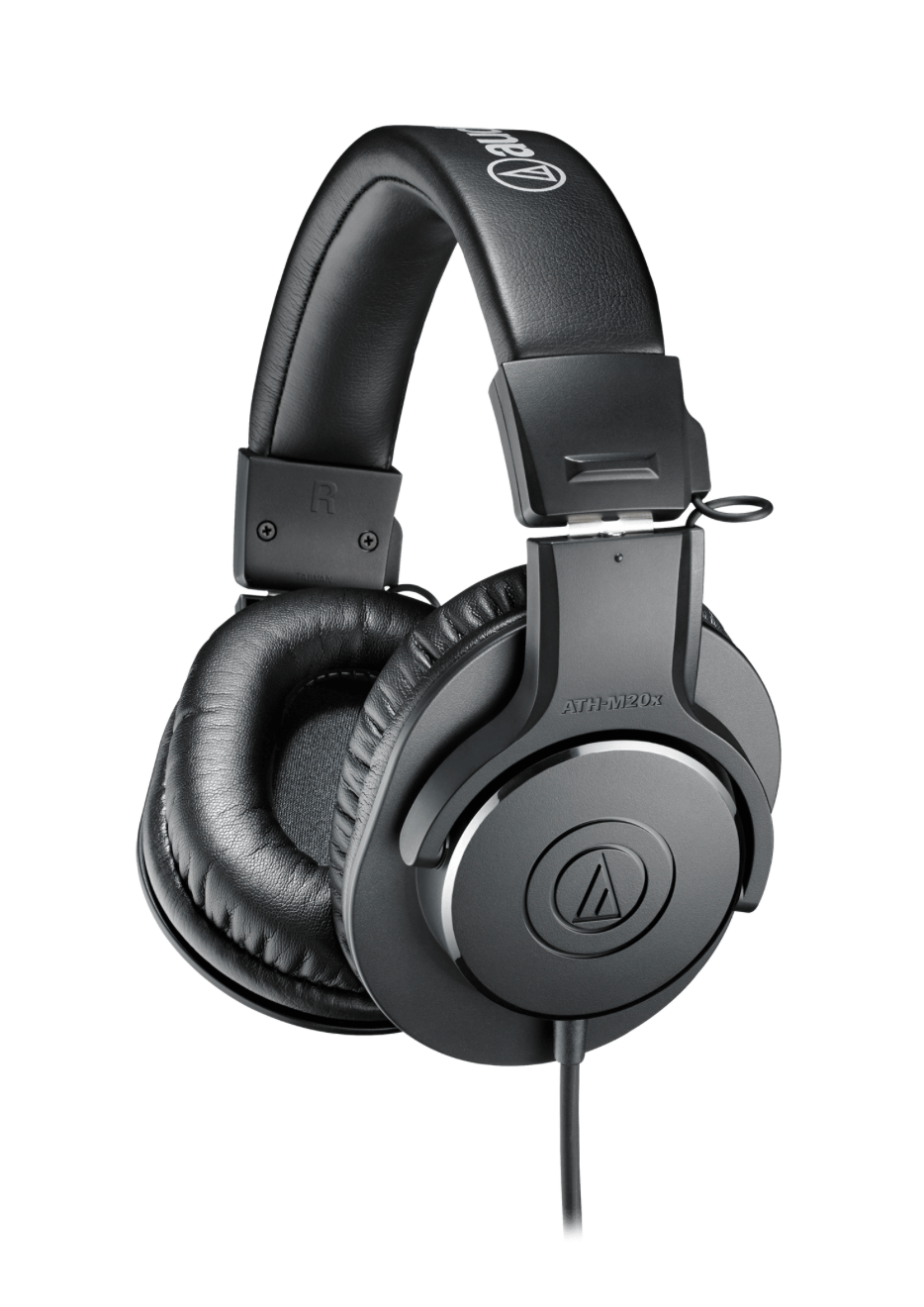 Audio-Technica ATH-M20X headphones on a studio table, highlighting their sleek design and superior build quality.