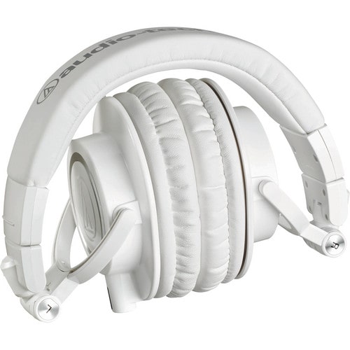 Folded view of the Audio-Technica ATH-M50xWH headphones displayed with swiveling earcups and three detachable cables for versatile studio use.
