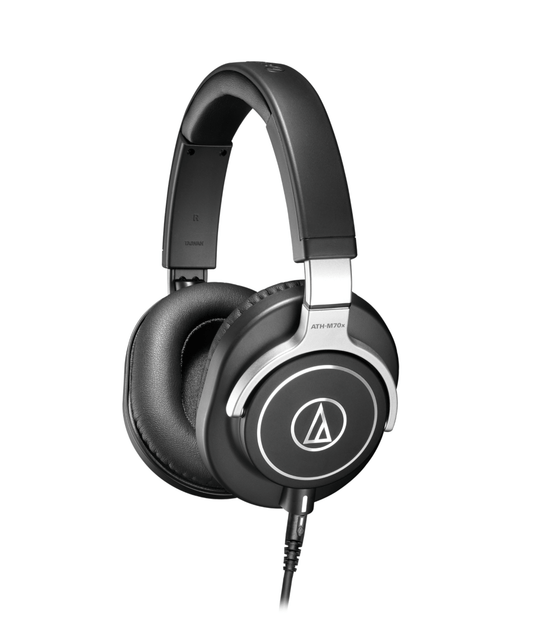 Close view of the Audio-Technica ATH-M70x headphones displaying their fold-flat design and interchangeable cables, ideal for professional audio tasks.