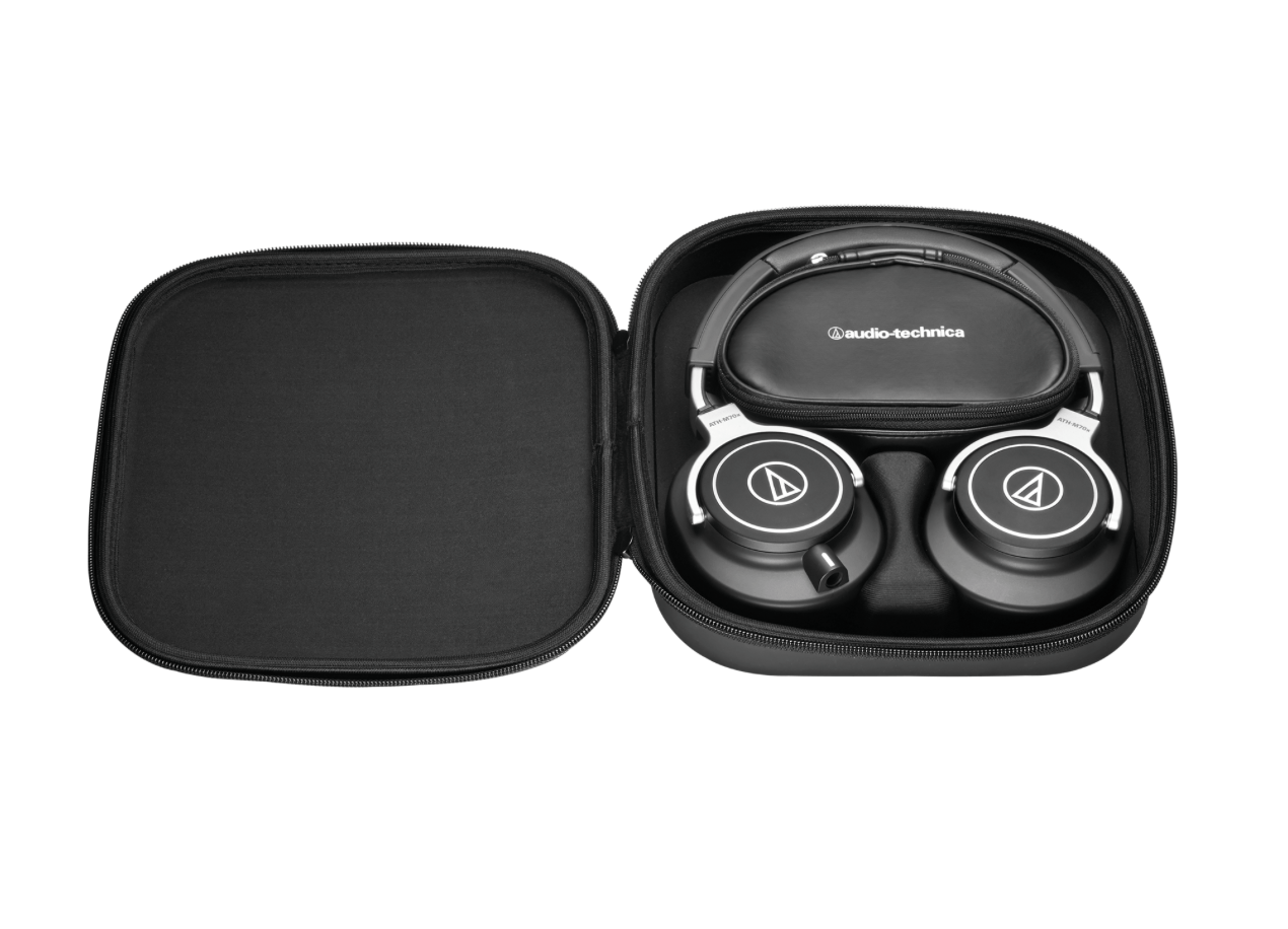 Storage case view of the Audio-Technica ATH-M70x headphones displaying their fold-flat design and interchangeable cables, ideal for professional audio tasks.