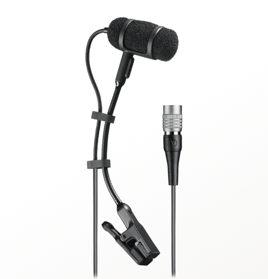 An Audio-Technica PRO35 clip-on microphone from the side attached to a saxophone, capturing vibrant sounds during a live performance.