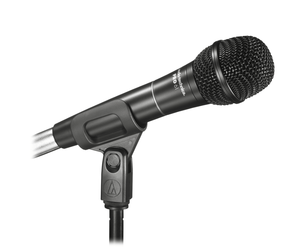 Performer singing into an Audio-Technica PRO61 microphone, showcasing from a side view its clear and natural vocal reproduction during a live concert.