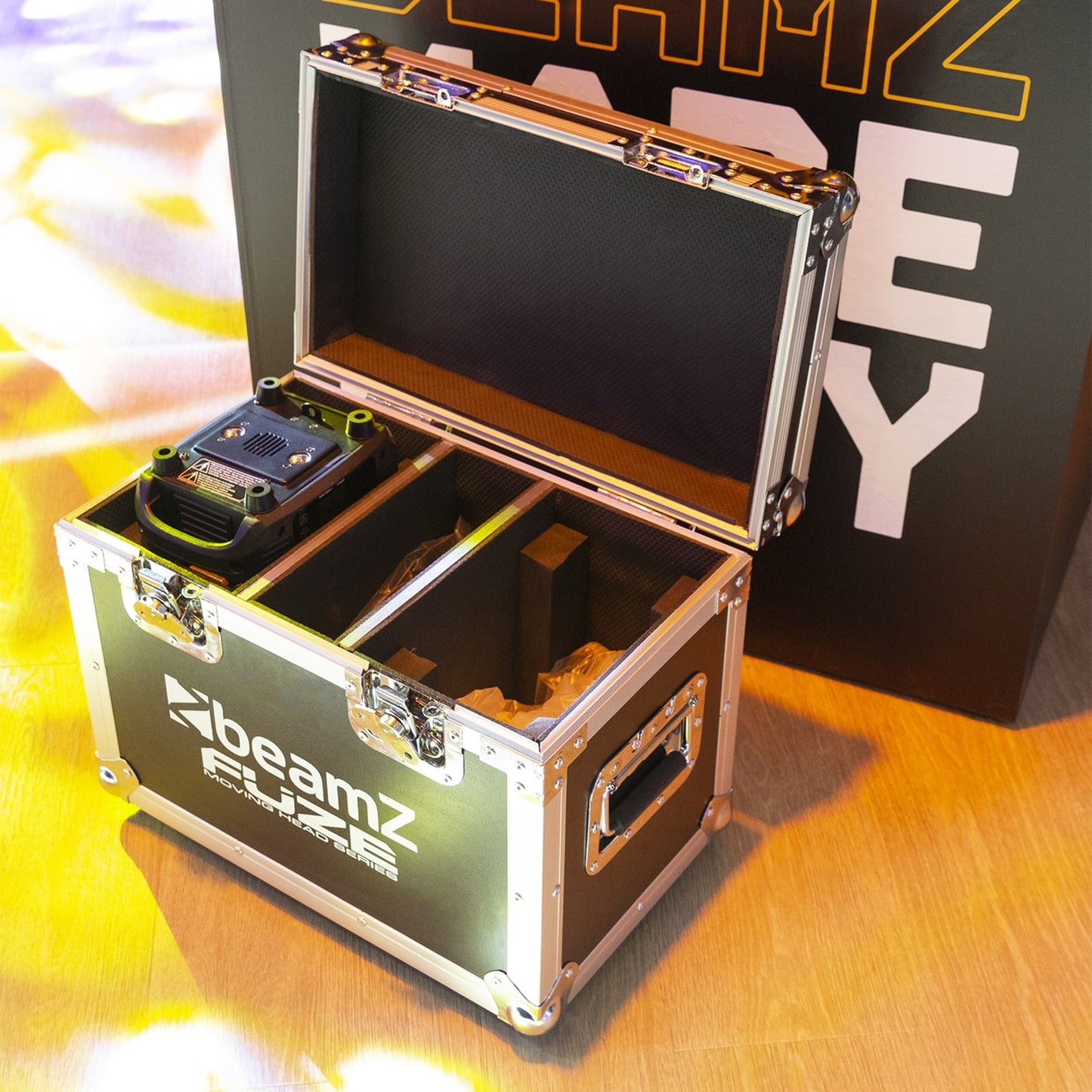 Lifestyle view of the Beamz Fuze75B Beam 75W LED Moving Head Set, ideal for DJs, bands, clubs, and installations, with flightcase.