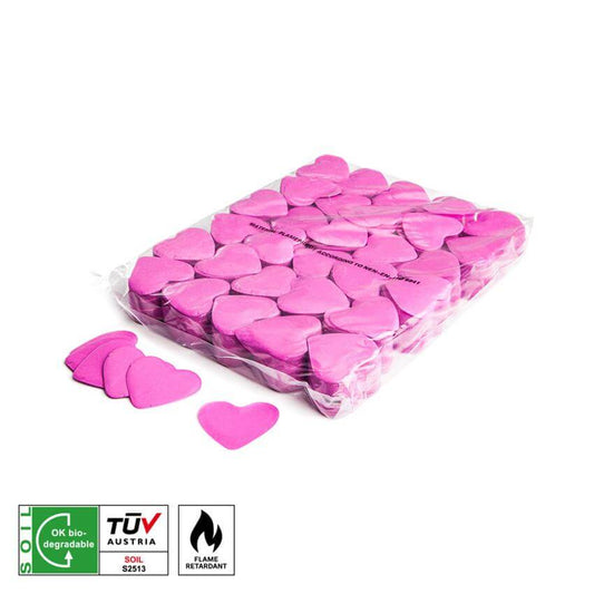MAGICFX Slowfall Confetti Hearts in pink, 55mm diameter, biodegradable and flame retardant, scattered on a surface.