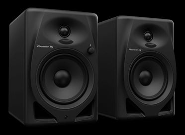 Pioneer DM-50D 5-inch bi-amped desktop monitor speakers in black, showcasing their sleek design and powerful sound capabilities.