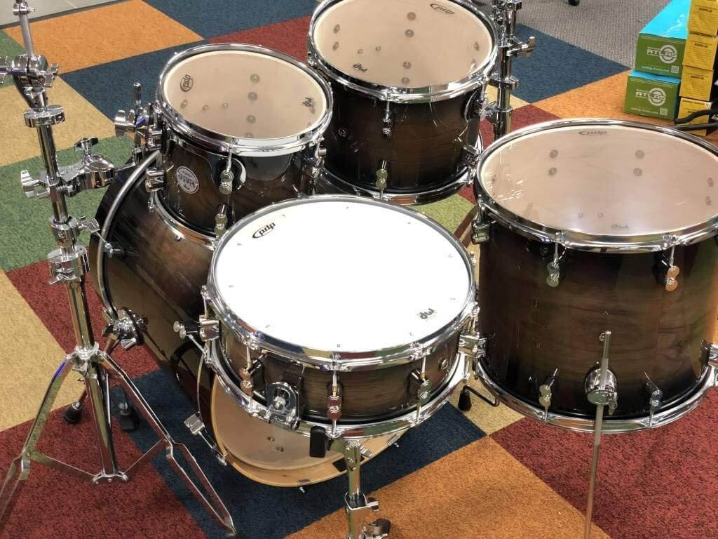 PDP Concept Exotic 5-Piece Shell Pack in Walnut and Charcoal Burst finish displayed on a neutral background.