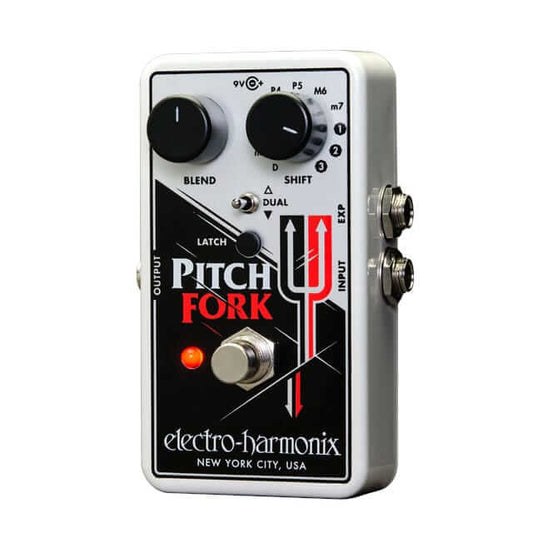 Electro-Harmonix Pitch Fork polyphonic pitch shifting guitar pedal displayed on a wooden surface.