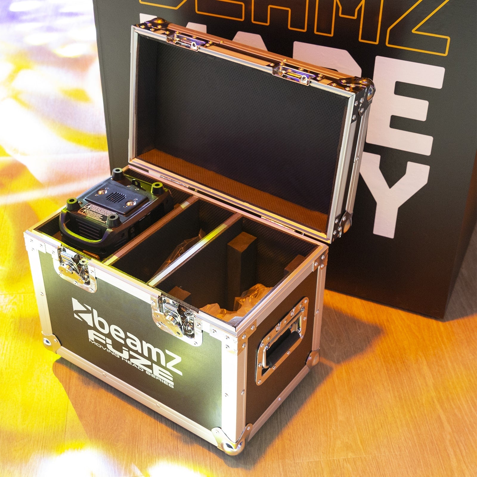 Lifestyle view of the Fuze75S LED Spot Moving Head set featuring 2x 75W white LEDs with interchangeable gobos and motorized focus, in a solid flightcase.