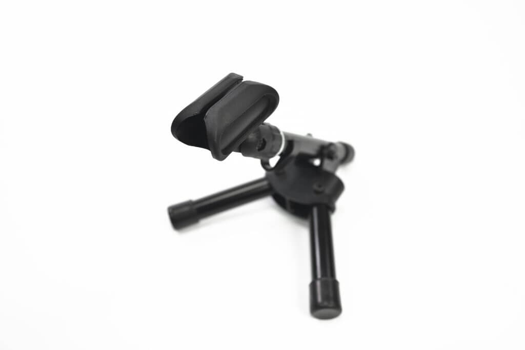Athletic 3/8 inch fully foldable desktop microphone stand displayed in a studio setting.