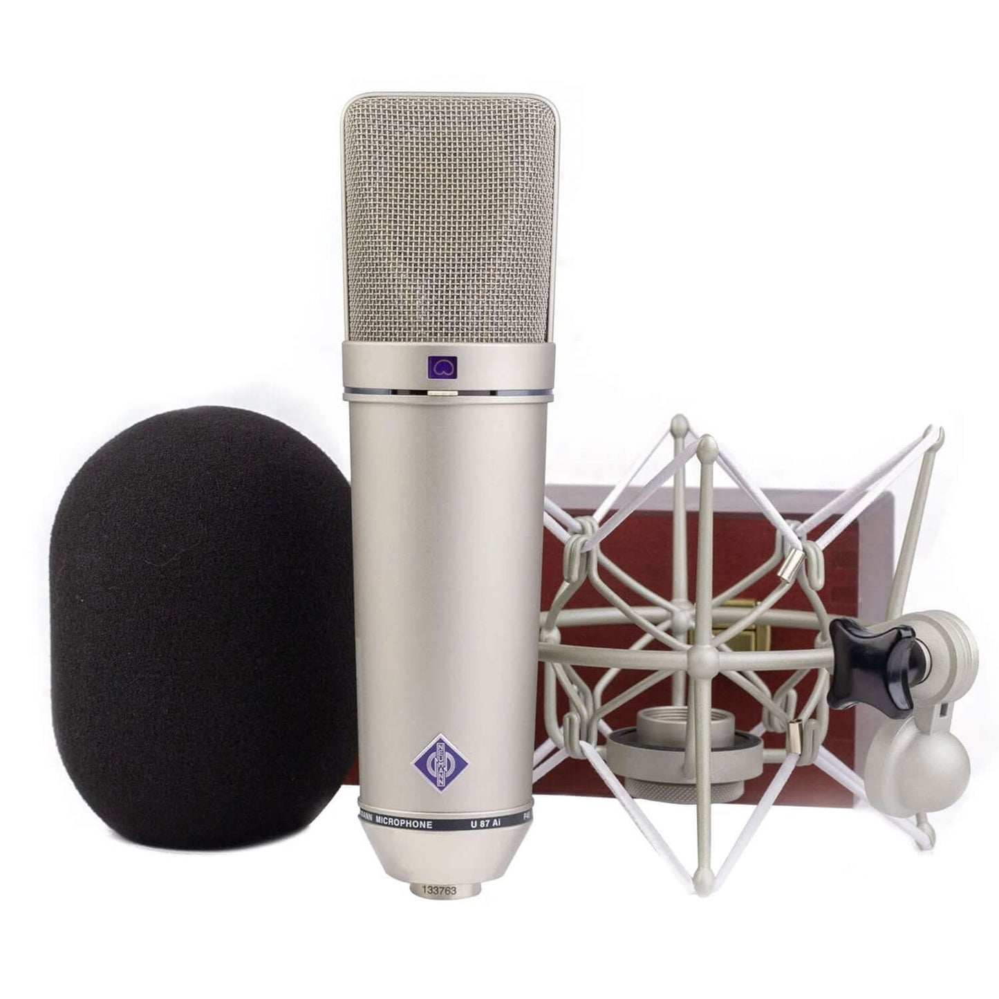 Neumann U 87 Ai Nickel Large Diaphragm Cardioid Microphone with Omni and Figure-8 Patterns displayed in a wooden box.