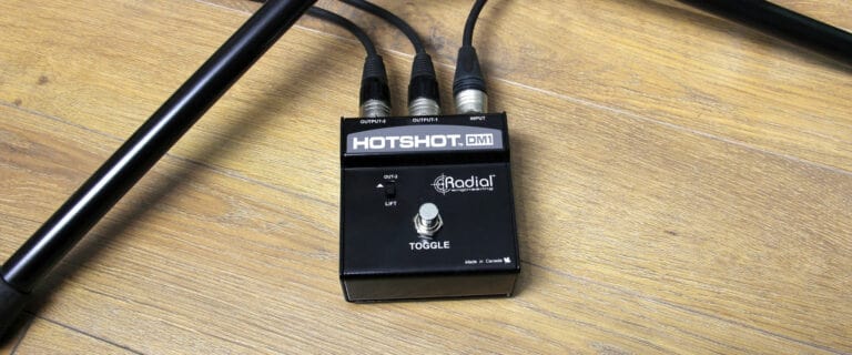 Lifestyle image view of the Radial HotShot DM-1 Microphone Switcher for live performance.