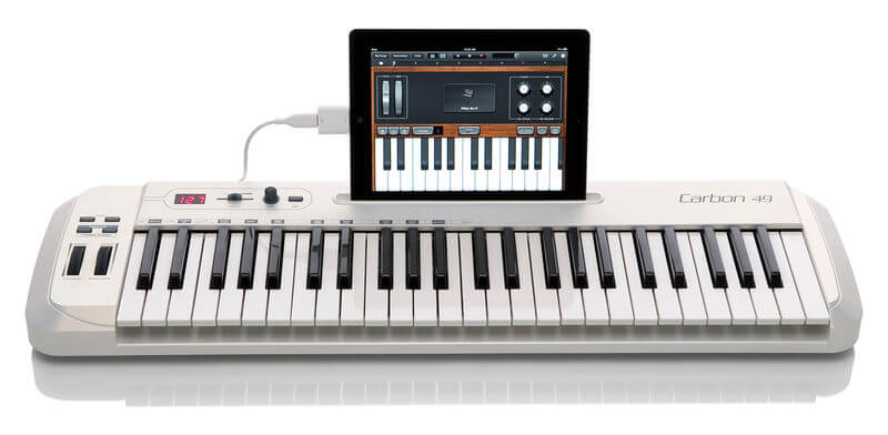 Samson Carbon 49 - 49-Key USB MIDI Keyboard Controller with assignable controls and iPad stand, showcasing its sleek design and functionality.