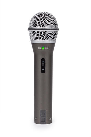 Samson Q2U handheld dynamic USB/XLR microphone with cardioid pattern, shown standing with accessories.