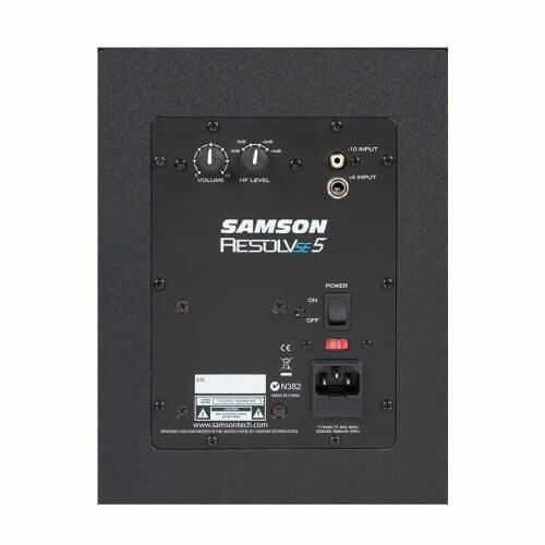 Samson Resolve SE5 active 5-inch studio monitor speakers with bi-amp 50W LF and 25W HF, displayed in a studio setting.