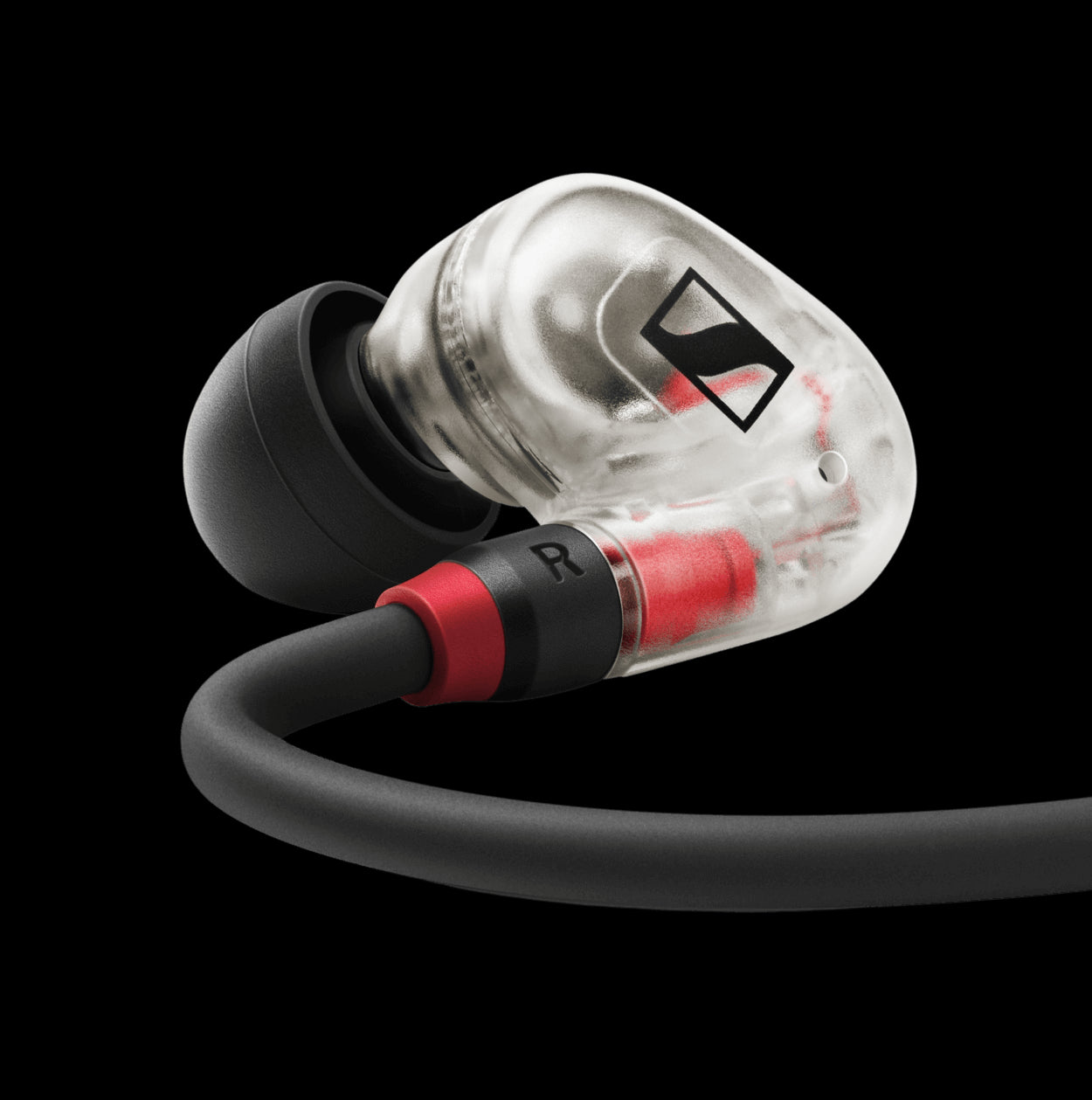 Closeup view of the Sennheiser IE 100 PRO Clear In-ear Headset with a 1.3m cable, soft pouch, and ear adapters in sizes S, M, and L.