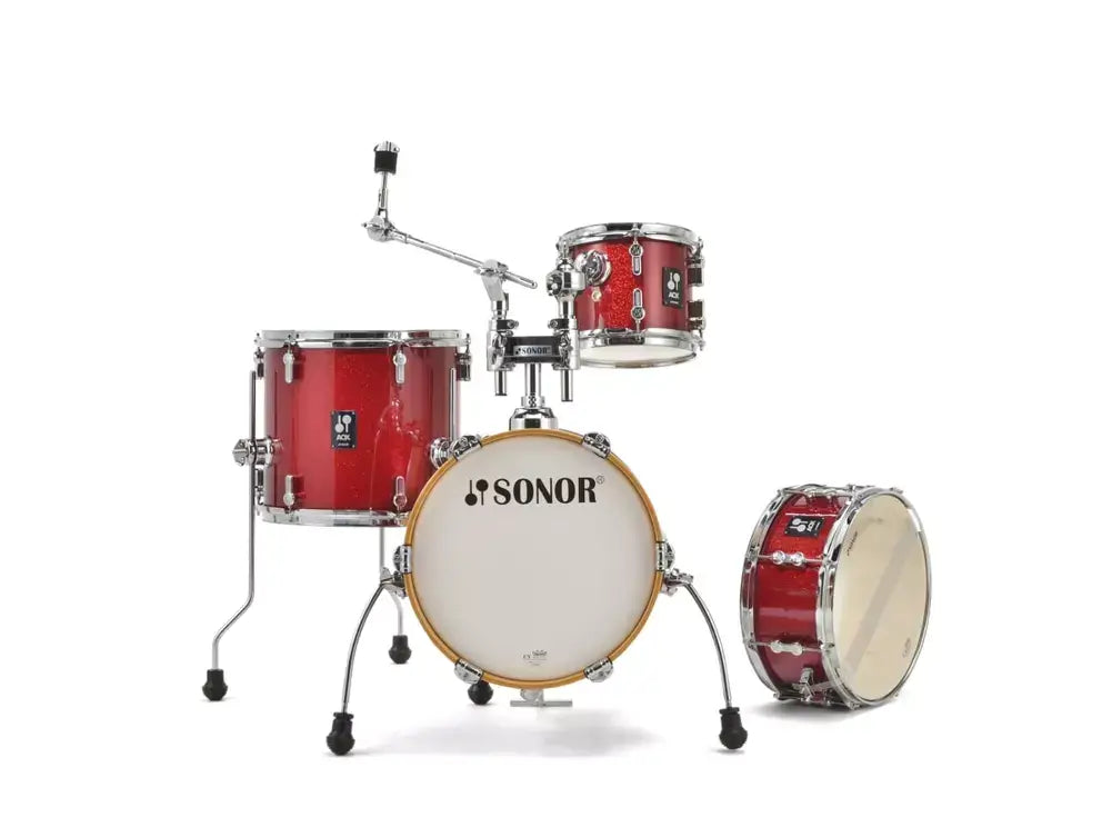 Sonor AQX Stage Drumset in Red Moon Sparkle finish, without cymbals.