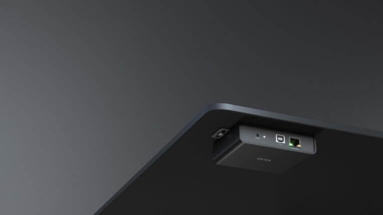 Xilica USB 2.0 to Dante Network Endpoint device, showcasing its compact design and PoE-powered installation capabilities.
