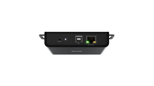 Xilica USB 2.0 to Dante Network Endpoint device, showcasing its PoE-powered design for flexible installation.