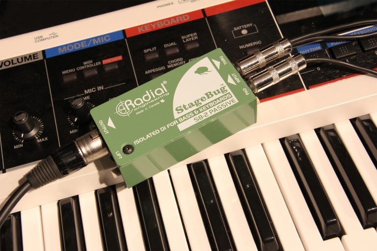 Lifestyle image view of the Radial StageBug SB-2 1-Channel Passive Direct Box for bass, keyboards, and acoustic guitars.
