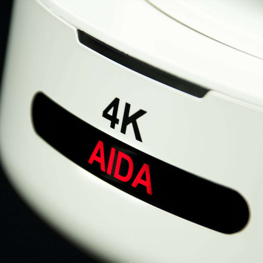 Close-up image of the AIDA Imaging Broadcast/Conference NDI|HX 4K PTZ Camera with 30X zoom in white color.