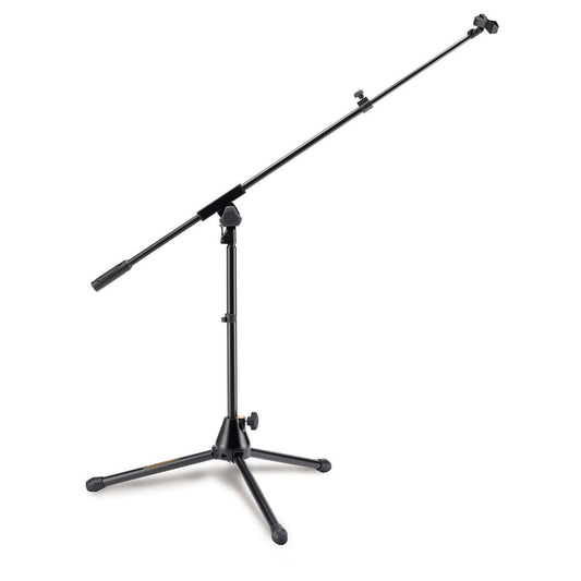 Hercules MS540B Kick Drum Mic Stand shown in a studio setting, designed for holding microphones securely during performances.