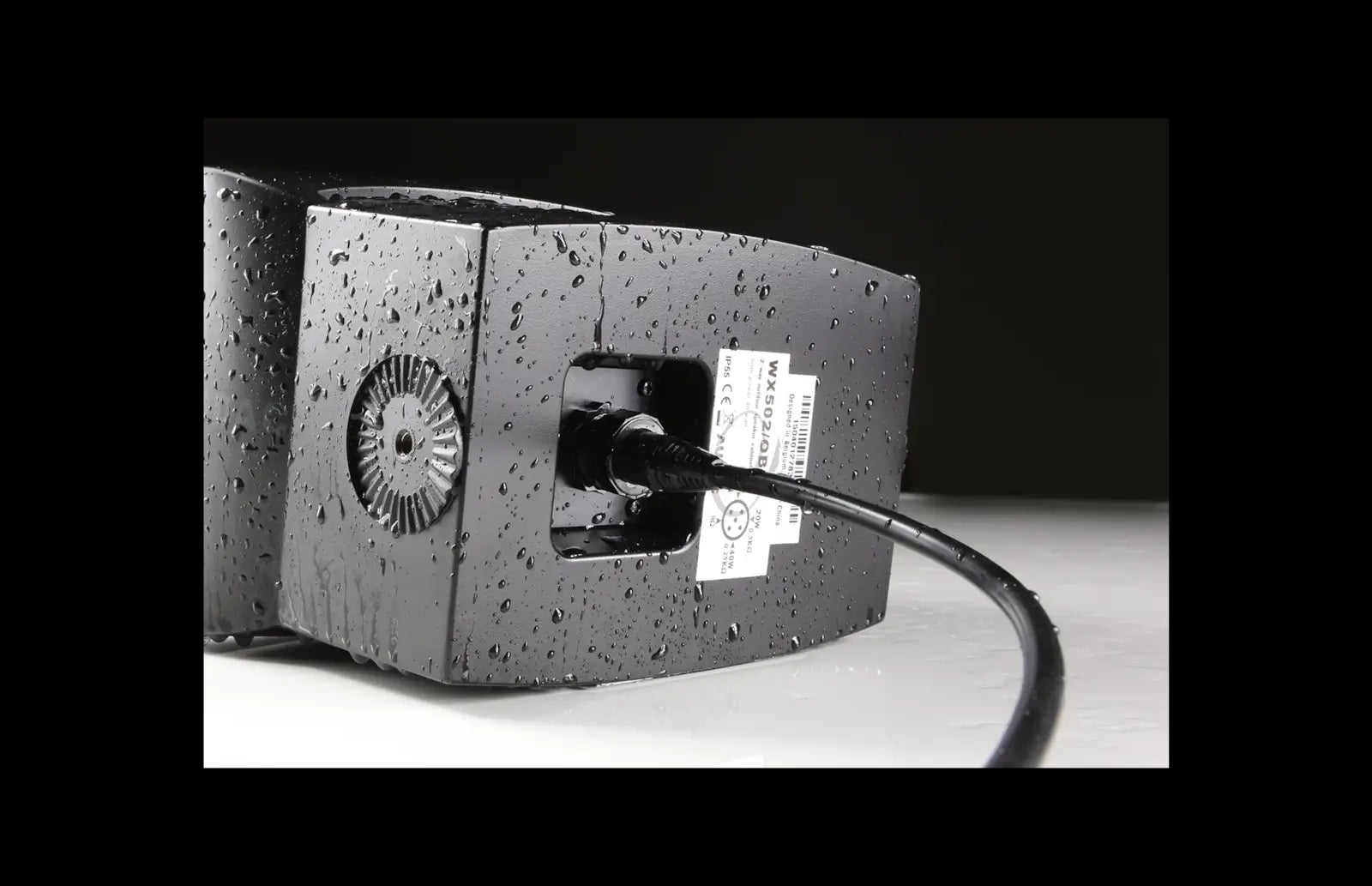 Backside view of the Audac Outdoor universal wall speaker in black, designed for outdoor use.