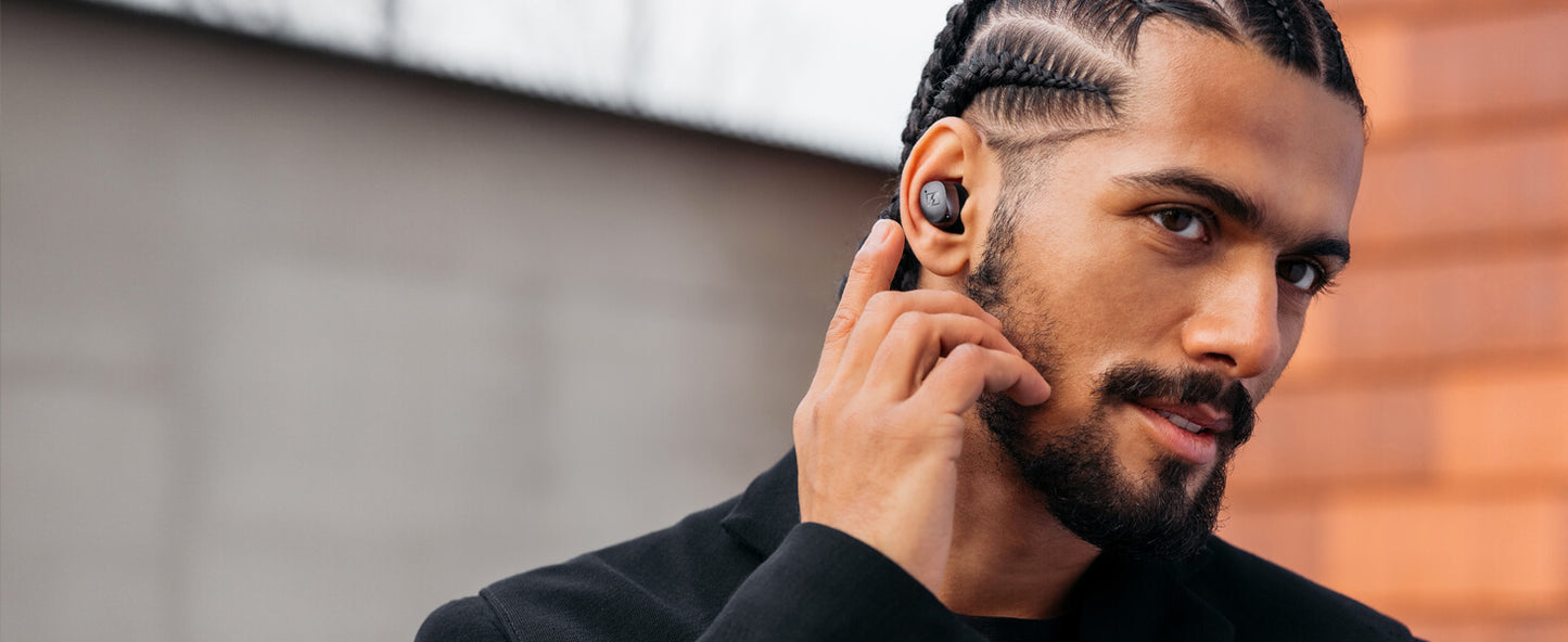 Sennheiser MOMENTUM True Wireless 4 earbuds in Black Copper color with Adaptive ANC and Bluetooth 5.4, showcasing a sleek design.