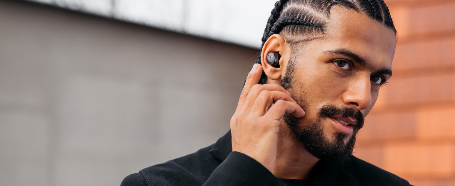 Sennheiser MOMENTUM True Wireless 4 earbuds in Black Copper color with Adaptive ANC and Bluetooth 5.4, showcasing a sleek design.