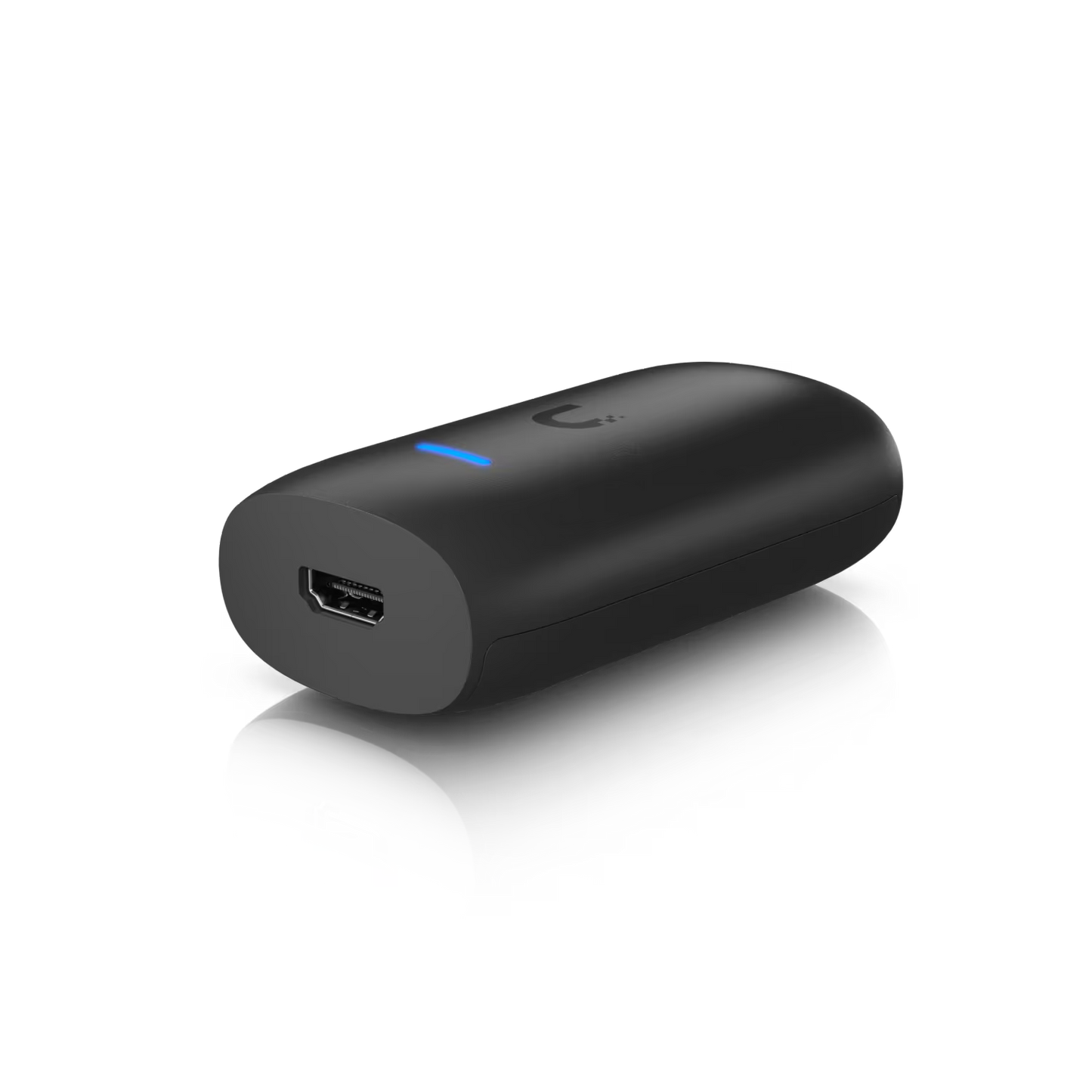 Ubiquiti UniFi Dual Band WiFi 6 HDMI Display Cast Lite with remote control on a desk.