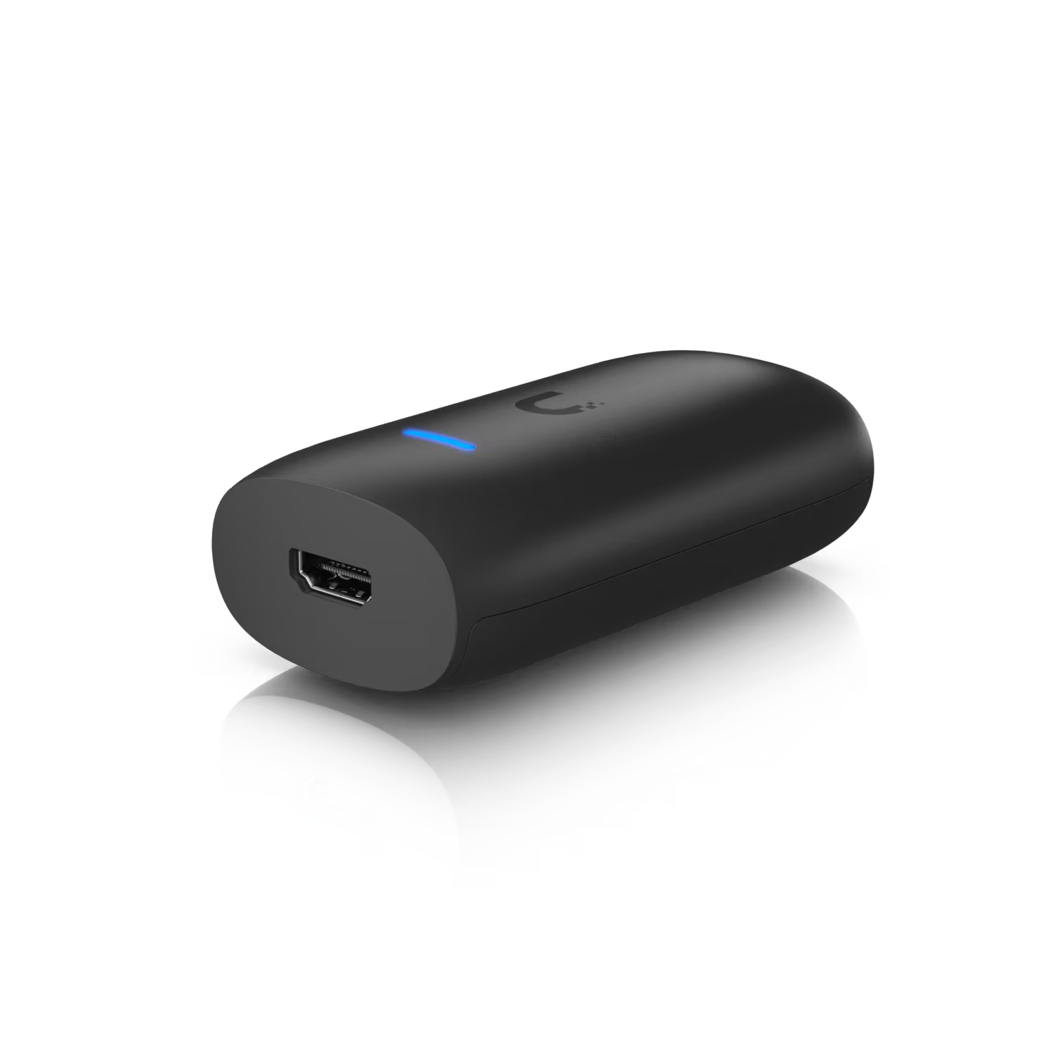 Ubiquiti UniFi Dual Band WiFi 6 HDMI Display Cast Lite with remote control on a desk.